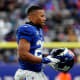 New York Giants running back Saquon Barkley (26) walks onto the field in the second half. The Giants lose to Washington, 22-7, at MetLife Stadium on Sunday, Jan. 9, 2022.